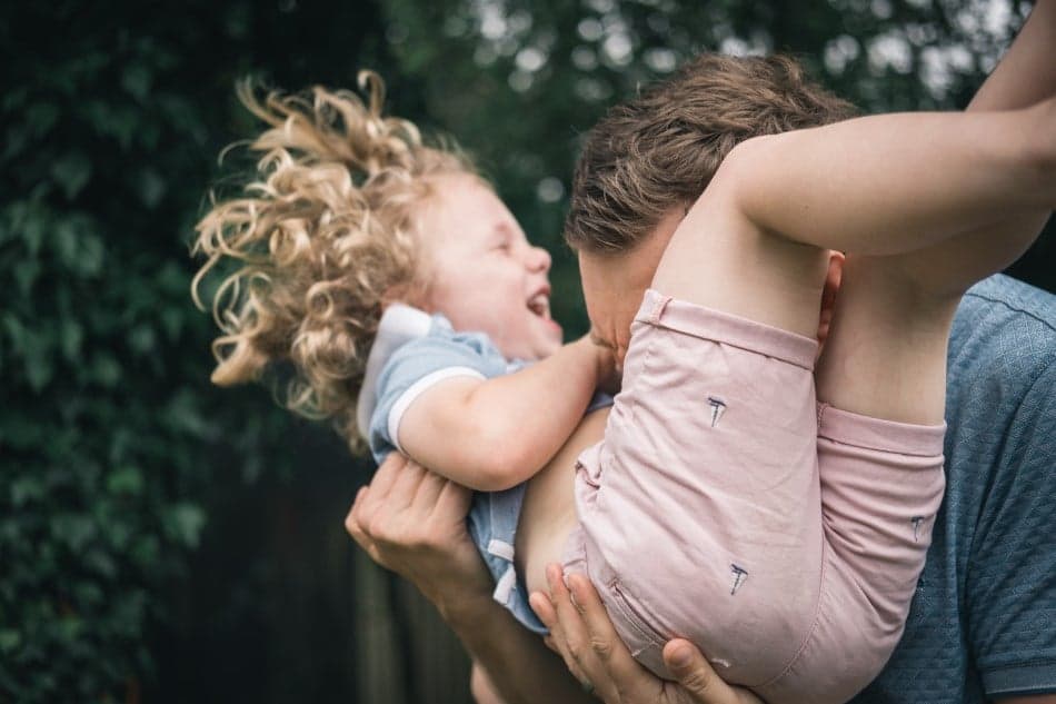 Dad playing with child